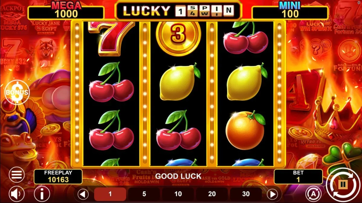 The base 3×3 fruit reels mid-spin on a bed of flames — cherries, lemons, an orange and a numbered gold coin (3), with GOOD LUCK on the message bar. MEGA 1,000 and MINI 100 sit in the header, freeplay 10,163 at BET 1.