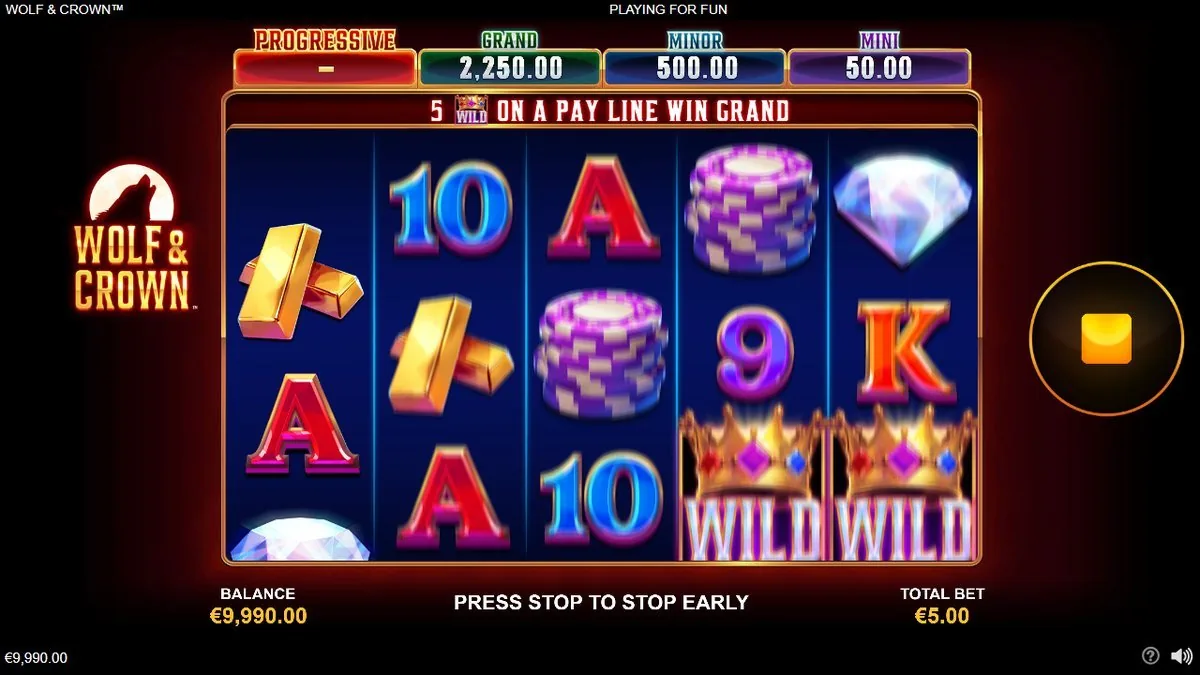 The 5×3 board dropping in with two Crown WILDs stacked on reels 4 and 5, gold bars and a diamond above — the header showing GRAND 2,250, MINOR 500, MINI 50 at a €5.00 total bet, and the banner: 5 WILDs on a pay line win GRAND.