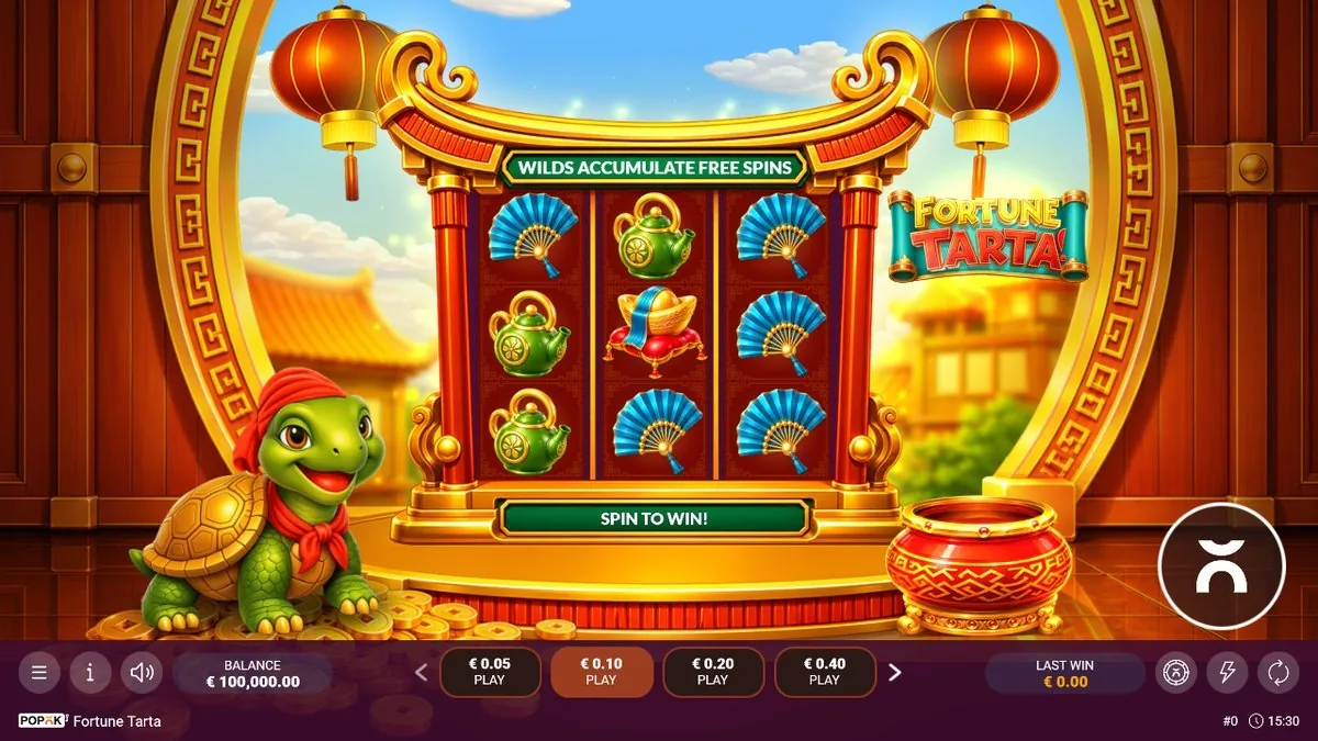 Base game on the pagoda grid: green teapots, blue folding fans and a gold ingot on a red pillow under the 'Wilds Accumulate Free Spins' banner, the red-scarfed turtle mascot perched on coins at the left, stakes €0.05 to €0.40.
